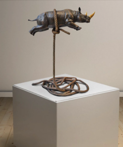 Flying rhino on short rope with a gold horn 1